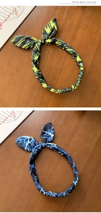 Détail de bandeaux à oreilles de lapin aux motifs camouflage vert et éclairs bleus