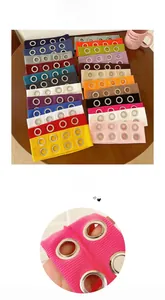 Macro detail of knit ribbed headbands with silver metal eyelets in various colors