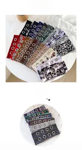 Flat lay display of diverse headbands with metal eyelets and leopard paisley patterns