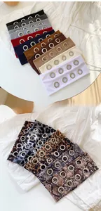 Detail of patterned headbands featuring metal eyelets in leopard print and solid colors