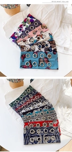 Detail of printed fabric headbands with metal eyelets in floral and paisley patterns