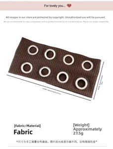 Detail view of brown ribbed knit headband with eight silver metal eyelet rings