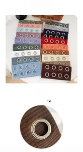 Detail of colorful ribbed knit headbands with punk style metal eyelets in various shades