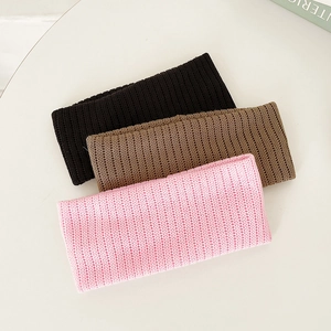 Elastic knitted headbands in black, coffee, and pink colors with ribbed texture for women
