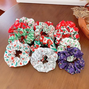 9-teiliges Weihnachts-Haargummi-Set mit Weihnachtsmann- und Baummotiven aus buntem Stoff