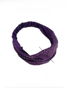 Detail of dark purple cotton headband featuring silver rhinestones and elastic design