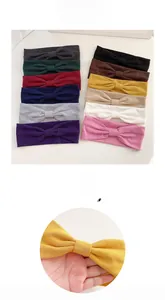 Detailed set of twelve colorful knotted knit sport headbands for yoga and daily hair styling
