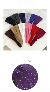 Detailed view of elastic headbands with rhinestones in multiple colors and textures