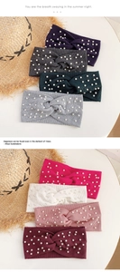 Close-up of pearl-embellished knitted twist headbands in eight elegant solid colors