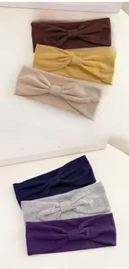 Detailed close-up of textured elastic knitted sport headbands in six assorted colors