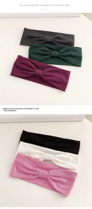 Detailed view of elastic bow headbands in six colors including gray, green, and pink