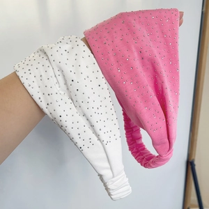 Elastic wide headband with rhinestones in white and bright pink with twist design