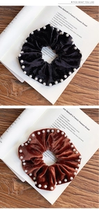 Detail view of vintage velvet scrunchies with pearls in black and caramel brown colors