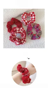 Close-up of red festive plush and tweed scrunchies set for winter hairstyles