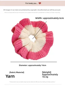 Detail of pink and beige knitted scrunchie showing 14cm diameter and yarn texture