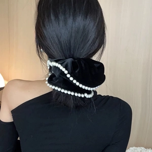 Elegant black velvet scrunchie with white pearl trim for retro hairstyles and ponytails