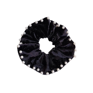 Elegant black velvet hair scrunchie with white pearl accents for retro hairstyles