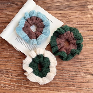 Three-pack handmade color-block knitted scrunchies with soft ribbed texture and elastic band