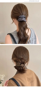 Detail showing plush bow print scrunchies in grey and brown for ponytails and buns