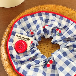 Blue checkered scrunchie with red cherry patterns and button detail for women