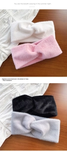 Detail of plush faux fur criss-cross headbands in white, pink, black, and grey colors