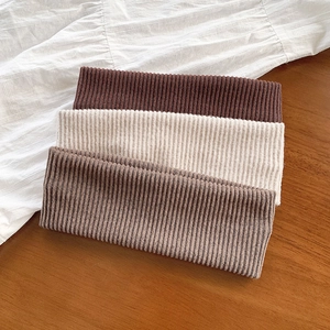 Three-piece set of solid color elastic wide headbands in coffee, beige, and taupe