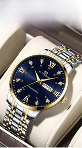 Detail of high-end men's watch with blue sunray dial and gold roman numeral indices