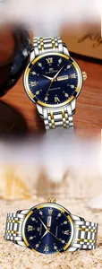 Detailed macro view of the two-tone steel watch featuring a blue dial with roman numerals