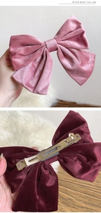 Detailed back view of handmade velvet hair bow clip with engraved metal spring clasp