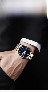 Close-up of luxury men's watch featuring a blue dial with Roman numerals on a wrist