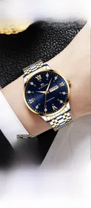 Detailed macro view of the two-tone steel watch band and calendar display window