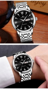 Macro detail of VA VA VOOM men's luxury watch showing the dual calendar and black textured dial
