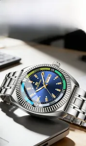 Close-up of blue sunray dial watch with three-color inner ring and steel strap on desk