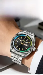 Macro shot of silver stainless steel fluted bezel and black dial with day-date window