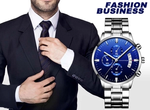 Close-up of men's business quartz watch with blue dial and steel strap worn with a suit