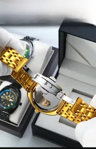 Detailed macro view of the gold stainless steel butterfly clasp and five-link watch band