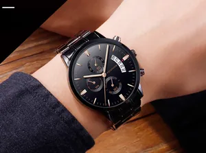 Men's quartz watch with blue face and silver link bracelet showing calendar and chronograph