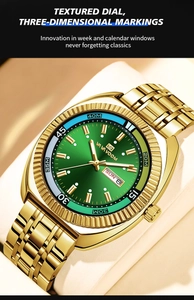 Detail of gold steel watch with green sunburst dial and dual calendar window