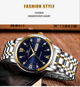 Macro shot of luxury blue dial men watch with gold roman numerals and day date display