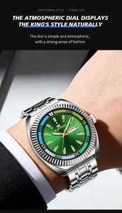 Macro shot of business quartz watch with green dial, silver steel band and fluted bezel
