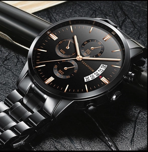 Macro detail of VAVAVOOM men's black stainless steel business chronograph with rose gold hands