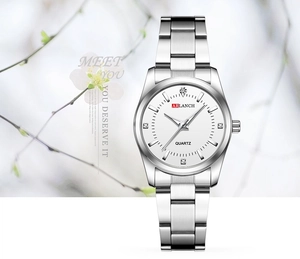 Close-up of ARLANCH silver watch with white dial and four diamond hour markers