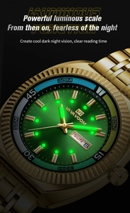 Macro shot of luminous hands and markers on a gold and green business quartz watch