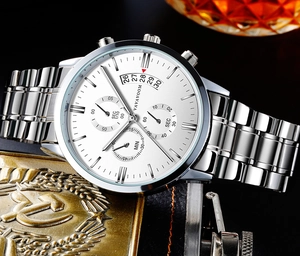 Macro view of men's business watch dial featuring chronographs and date window