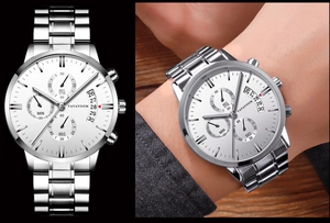 Detail view of silver stainless steel watch with white dial showing chronographs and date