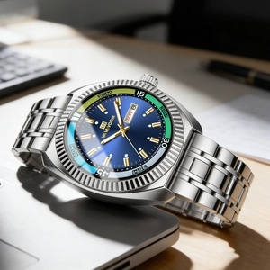 Men's business watch with blue sunray dial, fluted bezel and silver steel strap on a desk