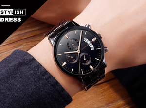 Detail of man wearing black business quartz watch with rose gold hands and chronograph dials