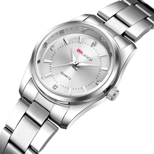 Silver quartz watch with stainless steel band and crystal markers on sunray dial