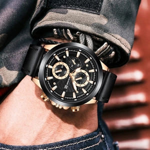 Men's gold and black chronograph watch with leather strap and luminous date display
