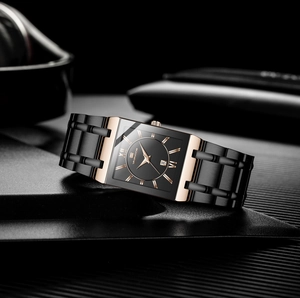 Detailed view of the square gold-tone bezel and black stainless steel band on a business watch